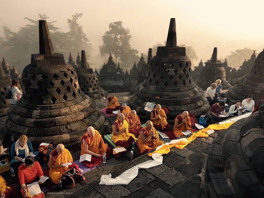 monks praying at borobudur temple compounds