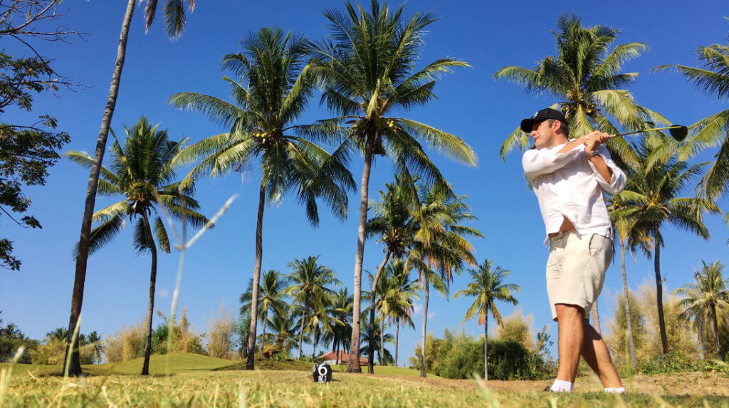 golf palm trees man hitting ball